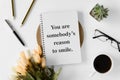 Notebook with wisdom quote and coffee cup. Royalty Free Stock Photo