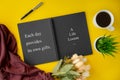 Notebook with wisdom quote and coffee cup. Royalty Free Stock Photo