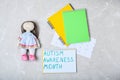 Notebook with words AUTISM AWARENESS MONTH