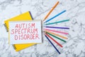 Notebook with words AUTISM SPECTRUM DISORDER