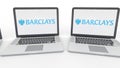 Notebooks with Barclays logo on the screen. Computer technology conceptual editorial 4K clip, seamless loop