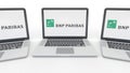 Notebooks with BNP Paribas logo on the screen. Computer technology conceptual editorial 3D rendering