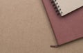 Notebooks on brown cardboard table. Copy space