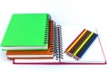 Notebooks and color pencils Royalty Free Stock Photo