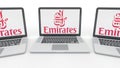 Notebooks with Emirates Airline logo on the screen. Computer technology conceptual editorial 3D rendering