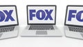 Notebooks with Fox Broadcasting Company logo on the screen. Computer technology conceptual editorial 3D rendering