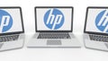 Notebooks with HP Inc. logo on the screen. Computer technology conceptual editorial 3D rendering