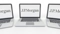 Notebooks with J.P. Morgan logo on the screen. Computer technology conceptual editorial 3D rendering
