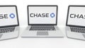 Notebooks with JPMorgan Chase Bank logo on the screen. Computer technology conceptual editorial 3D rendering