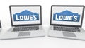 Notebooks with Lowe`s logo on the screen. Computer technology conceptual editorial 4K clip, seamless loop