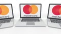 Notebooks with MasterCard logo on the screen. Computer technology conceptual editorial 3D rendering