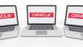 Notebooks with Oracle Corporation logo on the screen. Computer technology conceptual editorial 3D rendering