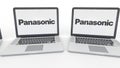 Notebooks with Panasonic Corporation logo on the screen. Computer technology conceptual editorial 4K clip, seamless loop