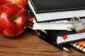Notebooks, pen and apples Royalty Free Stock Photo