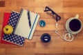 Notebooks, pen, glasses, apple on a wooden. Royalty Free Stock Photo