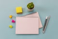 Notebooks, pen, stickers on a blue background. Conceptual image Royalty Free Stock Photo