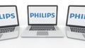 Notebooks with Philips logo on the screen. Computer technology conceptual editorial 3D rendering