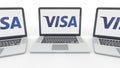Notebooks with Visa Inc. logo on the screen. Computer technology conceptual editorial 3D rendering