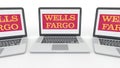 Notebooks with Wells Fargo logo on the screen. Computer technology conceptual editorial 3D rendering
