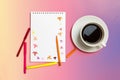 Notepad, colored felt-tip pens, cup with coffee on pastel yellow background. Concept autumn. Royalty Free Stock Photo