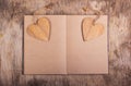 Notepad with blank pages and bookmarks in the shape of a heart. Wooden valentine. Valentine`s Day. Copy space