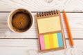 Notepad with bookmarks for documents, pen and a Cup of coffee. Colorful sticky multi-colored stickers. Planning concept Royalty Free Stock Photo