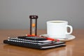 Notepad, calculator and cup of coffee Royalty Free Stock Photo