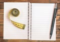 Notepad with centimeter and pen Royalty Free Stock Photo