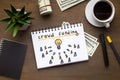 Notepad with crowdfunding concept laying on office table