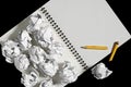 Notepad and crumpled paper balls Royalty Free Stock Photo