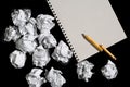 Notepad and crumpled paper balls Royalty Free Stock Photo