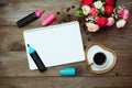 Notepad, cup black coffee and flowers Royalty Free Stock Photo