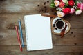 Notepad, cup black coffee and flowers Royalty Free Stock Photo