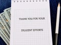 A notepad displays the message thanking someone for their diligent efforts, resting on a textured surface. Beside the