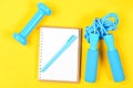 Notepad and fitness tools. Weight loss and active lifestyle concept Royalty Free Stock Photo