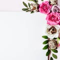 Notepad and floral composition in pastel colors. Happy easter card. Roses, leaves and quail eggs close-up Royalty Free Stock Photo