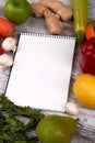 Notepad with fruit and vegetables. Royalty Free Stock Photo