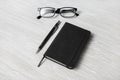 Notepad, glasses, mechanical pencil