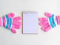 Notepad with glove on wood board background.using wallpaper for education, business photo.Take note of the product for book with p Royalty Free Stock Photo