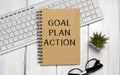 Notepad with Goal plan action text on keyboard with pencils Royalty Free Stock Photo