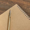 Notepad With Gold Fountain Pen On The Old Wood Table Royalty Free Stock Photo