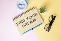 inscription FIND YOUR DREAM on the office desk