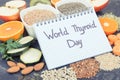 Notepad with inscription World Thyroid Day and best ingredients for healthy thyroid