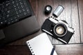 Notepad, laptop and photography equipment Royalty Free Stock Photo