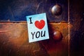 Notepad on a metallic pinboard, Text i love you with a heart Royalty Free Stock Photo