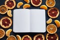 Notepad next to dry fruit slices on a dark background Royalty Free Stock Photo