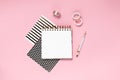 Notepad and notebooks with stationery. Golden, white, pink and black stationery back to school concept. Top horizontal view