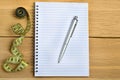 Notepad with pen and centimeter Royalty Free Stock Photo