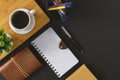 Notepad, pen and coffee on black background. Royalty Free Stock Photo