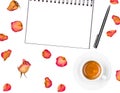 Notepad, pen, coffee cup and dried roses isolated on white background. Flat lay. Royalty Free Stock Photo